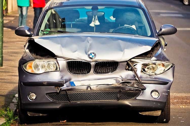 Crumpled front end of a car after a collision