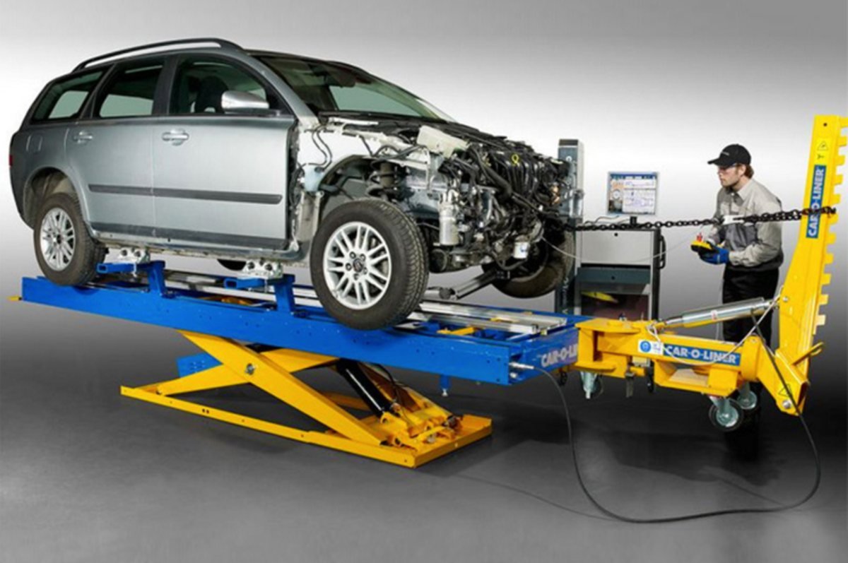 A vehicle mounted on a frame straightening rig