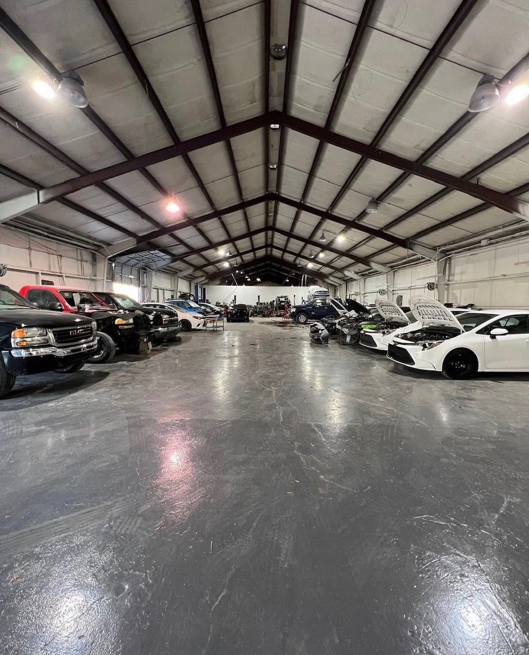Inside our indoor storage, packed with customer vehicles
