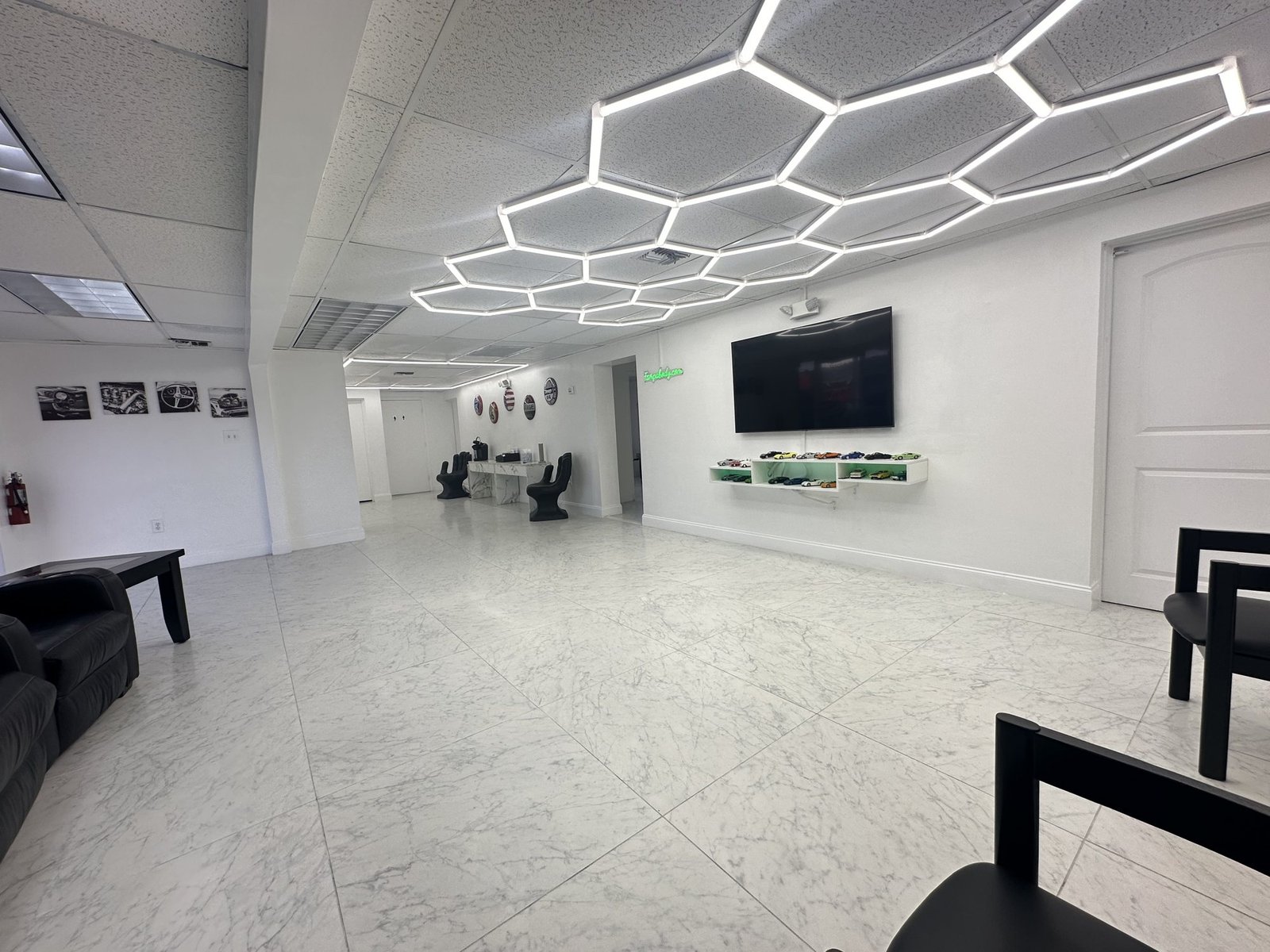 The Tampa Body Shop customer lounge, lit by hexagon LED panels