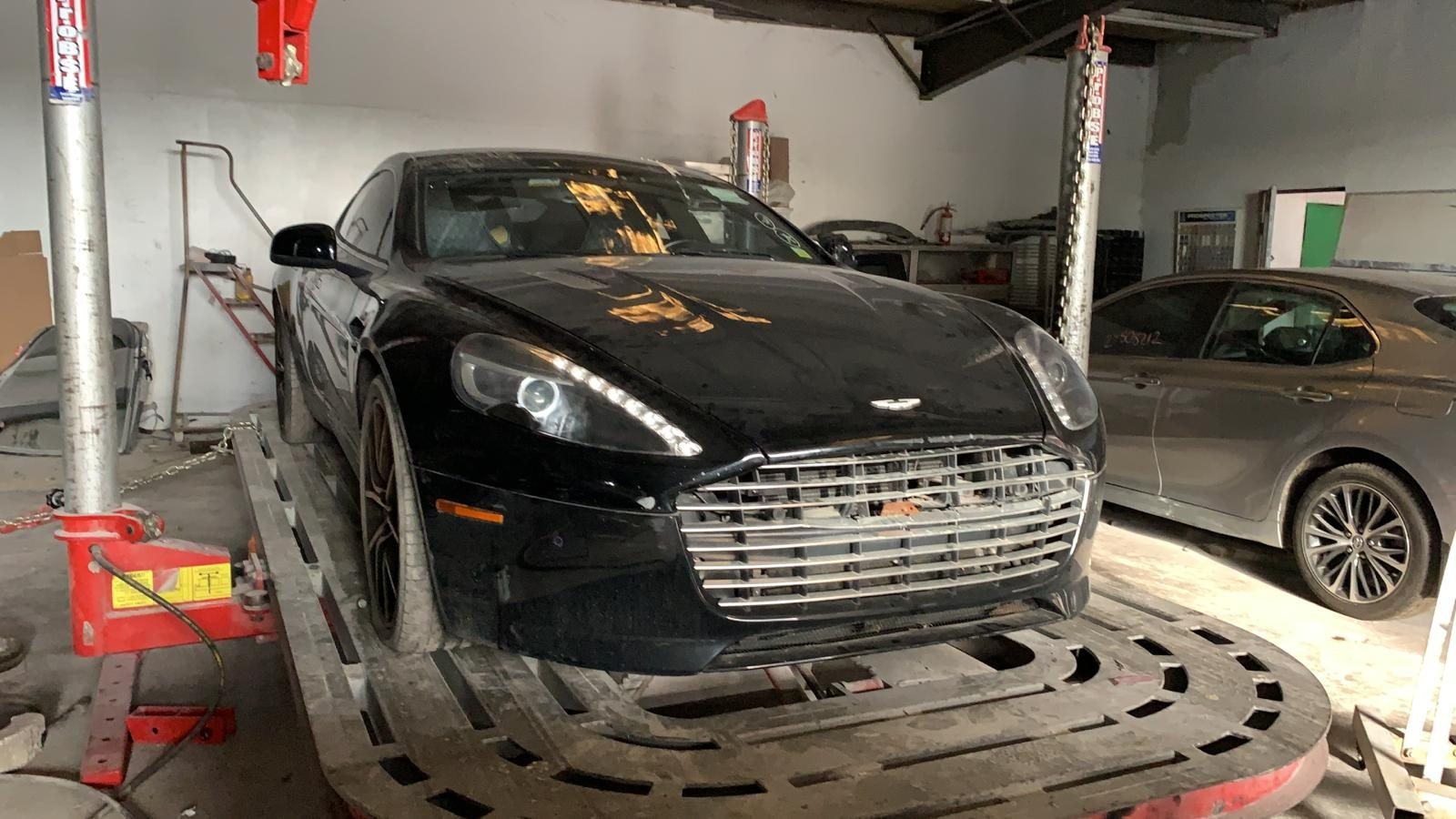 Aston Martin up on the lift for underbody inspection