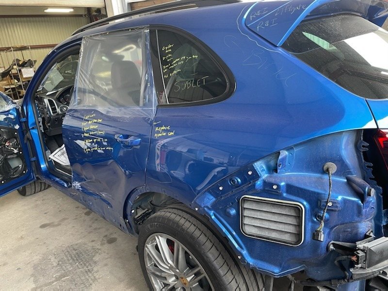 Blue Porsche stripped down for panel and paint work